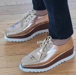 Pair of rose gold lifestyle sneakers from Paris . Size 7